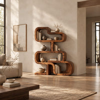 Stacked loop bookshelf with offset open cubbies on a flat base in a bright open plan living room