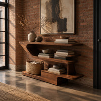 Open shelf console table with staggered shelves on a stepped base in an industrial loft entryway with exposed brick