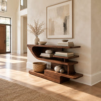 Open shelf console table with staggered shelves on a stepped base in a bright open plan entryway