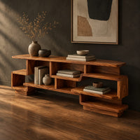 Staggered open shelf console table with interlocking cubbies, three-quarter view showing the grain