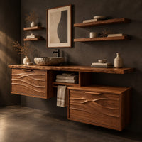 Corner detail of wooden vanity cabinet with two wave carved fronts at different heights beside wood, brass and linen samples
