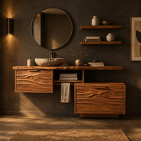 Wooden vanity cabinet with two wave carved fronts at different heights in a dark bathroom at golden hour