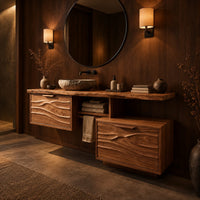 Wooden vanity cabinet with two wave carved fronts at different heights in an evening bathroom with walnut wall paneling