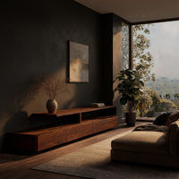 Low stepped riser TV console with drawers in a living room at golden hour