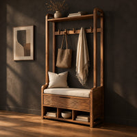 Storage bench with coat pegs, a top shelf, a cushioned seat and open cubbies, three-quarter view showing the grain