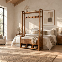 Storage bench with coat pegs, a top shelf, a cushioned seat and open cubbies in a bright open plan bedroom