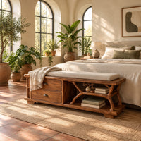 Storage bench with two drawers and a branch shaped open shelf in a bright bedroom with arched windows and plants