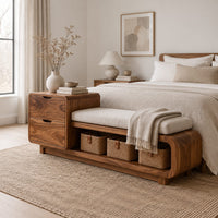 Storage bench with a two drawer end, cushioned seat and open shelf in a Scandinavian bedroom with white walls