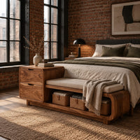 Storage bench with a two drawer end, cushioned seat and open shelf in an industrial loft bedroom with exposed brick