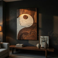 Sun and tide wall panel in pale and dark carved tones above a low console in an evening living room