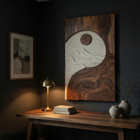 Sun and tide wall panel in pale and dark carved tones above a desk in a dark study corner