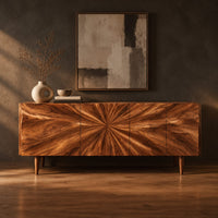 Wood sideboard with a sunburst grain pattern and tapered legs in a dark studio against a charcoal plaster wall