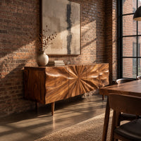 Wood sideboard with a sunburst grain pattern and tapered legs in an industrial loft dining room with exposed brick