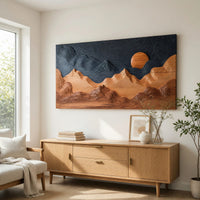 Sunrise mountain wall sculpture with a dark carved sky above a light oak sideboard in daylight