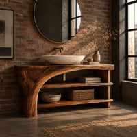 Bathroom vanity with a thick wood top, a sweeping arch support and open shelves in an industrial loft bathroom with exposed brick