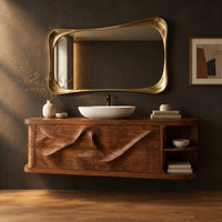 Floating vanity with two sweeping carved doors and curved open end shelves in a dark studio against a charcoal plaster wall
