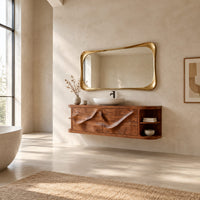 Floating vanity with two sweeping carved doors and curved open end shelves in a bright open plan bathroom