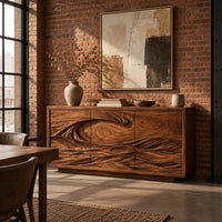Three door sideboard carved with one long curling wave in an industrial loft dining room with exposed brick