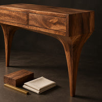 Corner detail of console table with two front panels and sweeping tapered legs beside wood, brass and linen samples