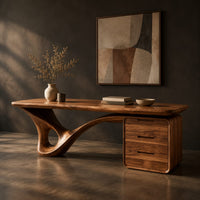 Desk with a looping sculpted leg and a three drawer pedestal, three-quarter view showing the grain