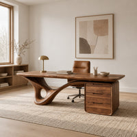 Desk with a looping sculpted leg and a three drawer pedestal in a Scandinavian home office with white walls