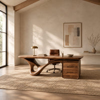 Desk with a looping sculpted leg and a three drawer pedestal in a bright open plan home office