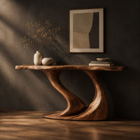 Console table with a slim top on one sweeping sculpted pedestal, three-quarter view showing the grain