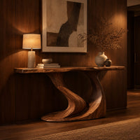 Console table with a slim top on one sweeping sculpted pedestal in an evening entryway with walnut wall paneling