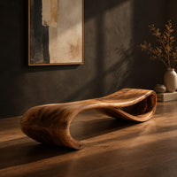 Long wooden bench shaped like a ribbon with a rolled end, three-quarter view showing the grain