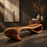 Corner detail of long wooden bench shaped like a ribbon with a rolled end beside wood, brass and linen samples