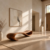 Long wooden bench shaped like a ribbon with a rolled end in a bright open plan entryway