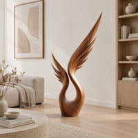 Wood sculpture of a swept wing with carved feather grooves and an open loop in a Scandinavian living room with white walls