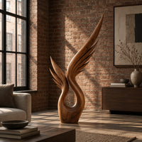 Wood sculpture of a swept wing with carved feather grooves and an open loop in an industrial loft living room with exposed brick
