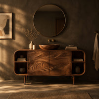 Bathroom vanity cabinet with swirl carved doors, open end shelves and slim legs in a dark bathroom at golden hour