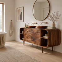 Bathroom vanity cabinet with swirl carved doors, open end shelves and slim legs in a Scandinavian bathroom with white walls