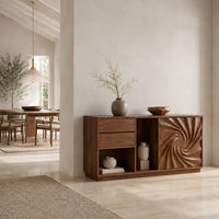 Wooden sideboard with a swirl carved door panel and open cubbies in a bright open plan dining room