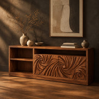 Sideboard with two swirl carved doors and open shelf bays at one end, three-quarter view showing the grain