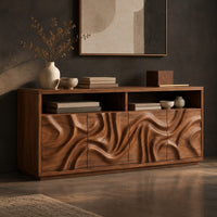 Corner detail of wood sideboard with swirl carved front panels and two open shelves along the top beside wood, brass and linen samples