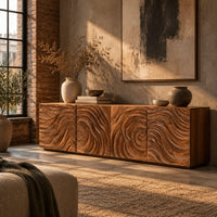 Low wooden tv stand with swirl carved front panels in an industrial loft living room with exposed brick