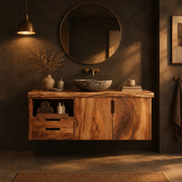 Floating vanity with swirling grain doors, two drawers and an open cubby in a dark bathroom at golden hour