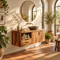 Floating vanity with swirling grain doors, two drawers and an open cubby in a bright bathroom with arched windows and plants