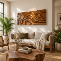Wide wall art panel carved with deep swirls and eddies that flow like water in a bright sunroom with green plants