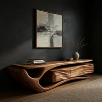 TV cabinet with a sweeping cantilever top over drawers in a dark studio against a charcoal wall