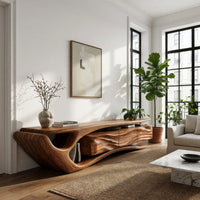 TV cabinet with a sweeping cantilever top over drawers in a sunlit room with large windows and plants