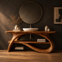 Long slab top on swooping branch like legs with a lower wooden shelf in a dark studio against a charcoal plaster wall