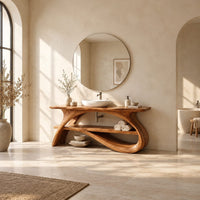 Long slab top on swooping branch like legs with a lower wooden shelf in a bright open plan bathroom