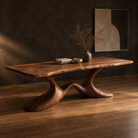 Dining table with a soft edged top on a swooping wave base, three-quarter view showing the grain