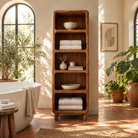 Tall open shelf cabinet with five bays and softened corners in a bright bathroom with arched windows and plants