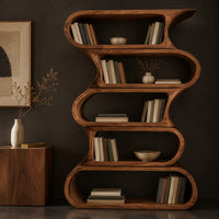 Corner detail of tall bookshelf made of five stacked open wavy loop tiers beside wood, brass and linen samples