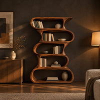 Tall bookshelf made of five stacked open wavy loop tiers in a dark living room at golden hour